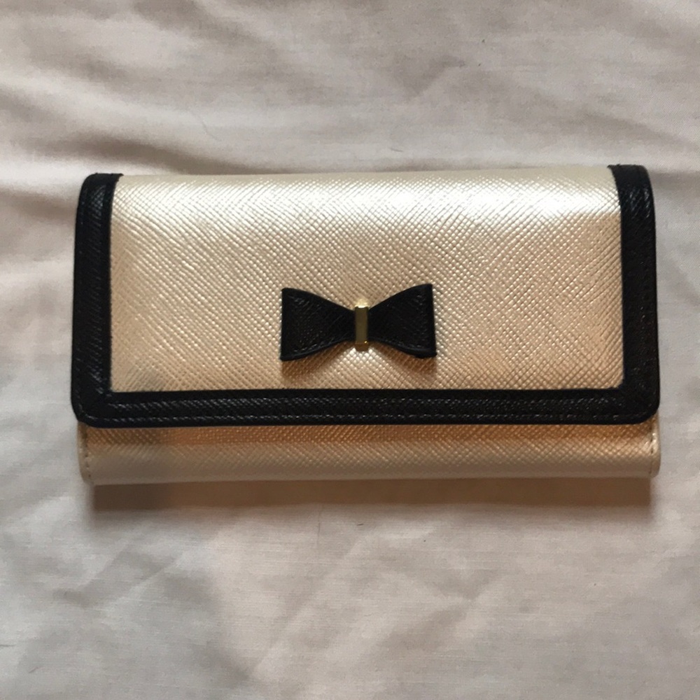 Black and cream colored wallet